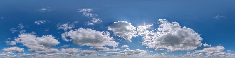 hdri 360 panorama of blue sky with white beautiful clouds. Seamless panorama with zenith for use in 3d graphics or game development as sky dome or edit drone shot for sky replacement photo