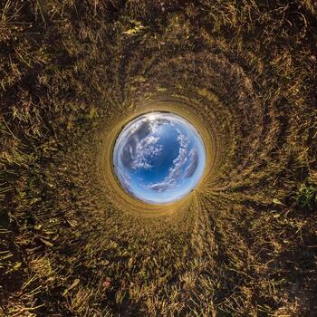 Blue little planet. Inversion of tiny planet transformation of spherical panorama 360 degrees. Spherical abstract aerial view. Curvature of space. photo