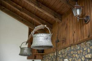 Old metal water buckets - traditional Bulgarian copper water container. photo