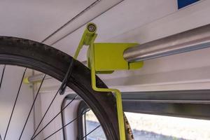 bike carrier on a train. Transport device for bicycles in the wagon. photo