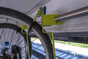 bike carrier on a train. Transport device for bicycles in the wagon. photo