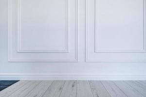 Detail of corner flooring with intricate crown molding and plinth. photo