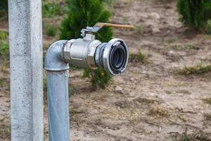 Garden water tap. faucet for watering or for irrigation of agricultural plants in fields. photo