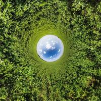 Blue little planet. Inversion of tiny planet transformation of spherical panorama 360 degrees. Spherical abstract aerial view. Curvature of space. photo