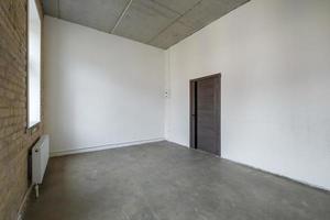 empty white room with repair and without furniture. room for office or store photo