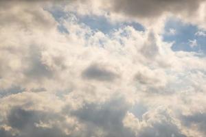 Blue sky background with white striped clouds. Clearing day and Good windy weather photo