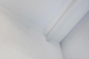 Detail of corner ceiling cornice with intricate crown moulding. photo