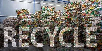 Plastic bales of rubbish at the waste treatment processing plant. Recycling separatee and storage of garbage for further disposal, trash sorting. Business for sorting and processing of waste. photo