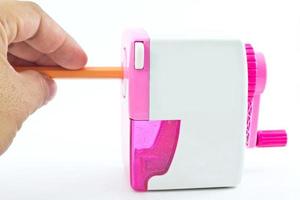 Mechanical sharpener of pencil on the white background photo