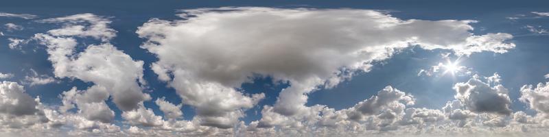 Seamless clear blue sky hdri panorama 360 degrees angle view with zenith and beautiful clouds for use in 3d graphics as sky dome or edit drone shot photo