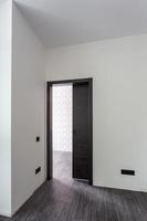 black wooden door in dark style color for modern interior and apartments flat or office photo