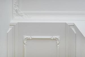 Detail of corner ceiling and walls with intricate crown moulding photo