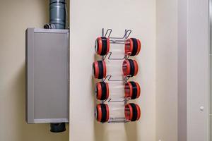 rows of empty pneumatic tubes of transfer system station in modern clinic, designed for fast operational transfer of analyzes, drugs and documents through air tunnels photo