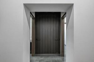 long white empty corridor in interior of entrance hall of modern apartments, office or clinic photo