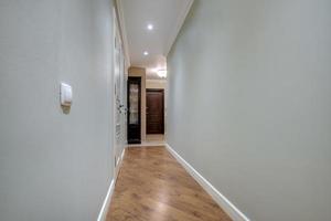 long empty corridor in interior of entrance hall of modern apartments, office or clinic photo