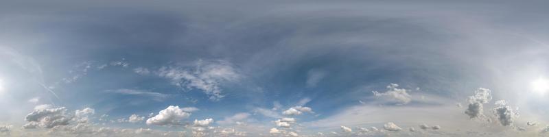 blue sky hdri 360 panorama with halo and haze in beautiful clouds in seamless projection with zenith for use in 3d graphics or game development as sky dome or edit drone shot for sky replacement photo