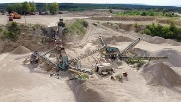 Aerial view of conveyor system of opencast limestone mining quarry. video