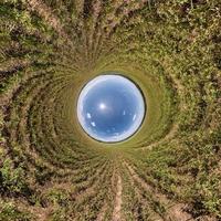 Blue little planet. Inversion of tiny planet transformation of spherical panorama 360 degrees. Spherical abstract aerial view. Curvature of space. photo