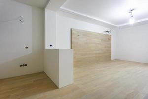 Empty unfurnished room with minimal preparatory repairs. interior with white walls photo