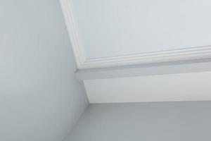 Detail of corner ceiling cornice with intricate crown molding. photo
