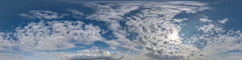 blue sky hdri 360 panorama with white beautiful clouds in seamless projection with zenith for use in 3d graphics or game development as sky dome or edit drone shot for sky replacement photo