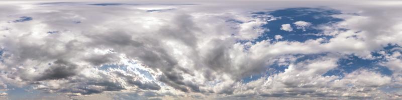 blue sky with beautiful fluffy cumulus clouds. Seamless hdri panorama 360 degrees angle view without ground for use in 3d graphics or game development as sky dome or edit drone shot photo