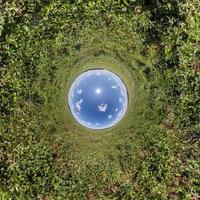 Blue little planet. Inversion of tiny planet transformation of spherical panorama 360 degrees. Spherical abstract aerial view. Curvature of space. photo