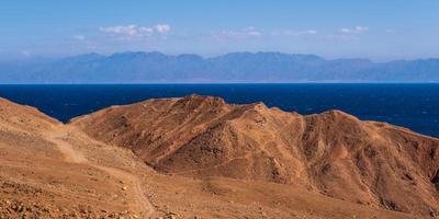 panorama view from the height of the mountains range  to the blue sea photo