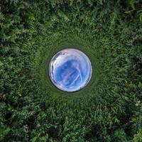 Blue little planet. Inversion of tiny planet transformation of spherical panorama 360 degrees. Spherical abstract aerial view. Curvature of space. photo