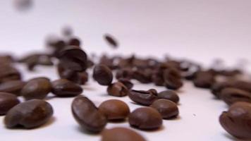 f coffee on a white table with coffee beans. Stock video footage.