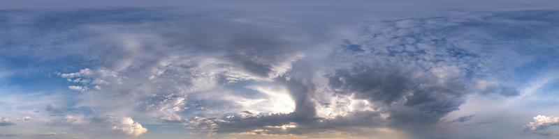 Seamless blue evening sky hdri panorama 360 degrees angle view with zenith and beautiful clouds for use in 3d graphics as sky dome or edit drone shot photo