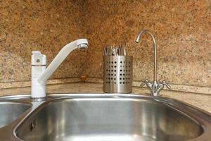 Water tap sink with faucet in expensive kitchen photo