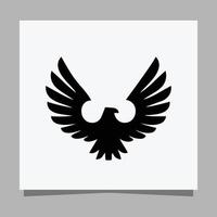 Vector illustration of a black eagle on white paper which is perfect for logos, business cards, emblems and icons.