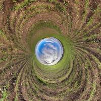 Blue little planet. Inversion of tiny planet transformation of spherical panorama 360 degrees. Spherical abstract aerial view. Curvature of space. photo