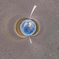 blue sky ball in middle of swirling field. Inversion of tiny planet transformation of spherical panorama 360 degrees. Curvature of space. photo