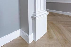 Detail of corner flooring with intricate crown molding. photo