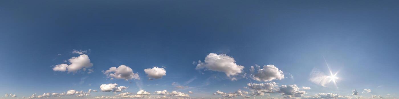 blue sky hdr 360 panorama with white beautiful clouds in seamless projection with zenith for use in 3d graphics or game development as sky dome or edit drone shot for sky replacement photo