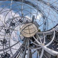 abstract swirling inside a metal frame tower alphabet into tiny planet photo