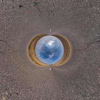 Blue little planet. Inversion of tiny planet transformation of spherical panorama 360 degrees. Spherical abstract aerial view. Curvature of space. photo