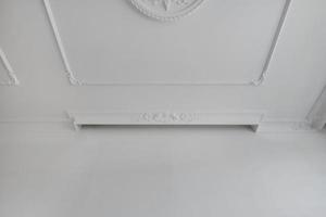 Detail of corner ceiling cornice with intricate crown molding. photo