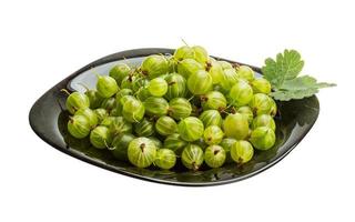 Gooseberry on the plate and white background photo