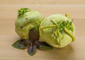 Kohlrabi on wooden background photo