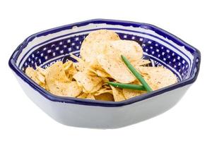 Potato chips in a bowl on white background photo