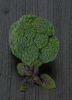 Broccoli on wooden background photo