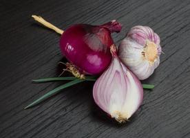 Red onion on wooden background photo