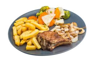 T-bone steak on the plate and white background photo