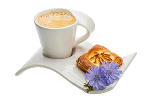 Coffee with pastry on white background photo