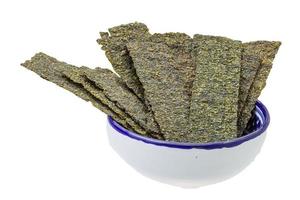 Nori in a bowl on white background photo