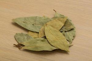 Laurel on wooden background photo