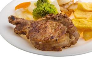 T-bone steak on the plate and white background photo
